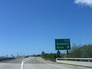 Westbound California 217 (Clarence Ward Memorial Boulevard) reaches Exit 1, Sandspit Road and Moffett Place to Santa Barbara Municipal Airport and Goleta Beach.