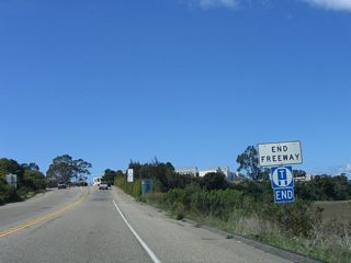 California 217 and its freeway end at this point, where the shoulder white striping ends.
