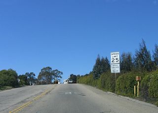 The speed limit reduces to 25 miles per hour.