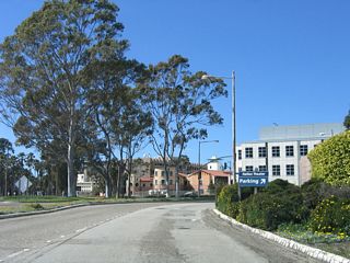 Upon entering the campus of UCSB, the roadway splits into separate one-way roads. UCSB takes over maintenance of the roads. Follow the signs to various destinations on the campus. From here, two one-way lanes travel west on Mesa Road, with a traffic signal connection to Lagoon Road and other routes to various parts of the campus.