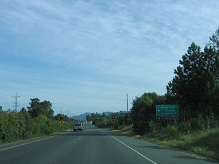 Continuing north on the expressway alignment for California 221 north, the next traffic signal is for Streblow Drive and Napa Valley Community College and Kennedy Park.