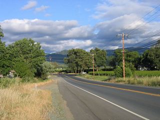 Vineyards and agricultural fields line California 222 (Talmage Road) after it crosses the Russian River and approaches the small town of Talmage.