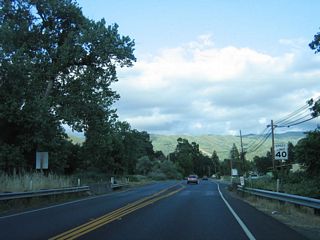 The speed limit decreases as California 222 enters Talmage.