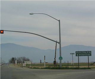 Eastbound California 223 meets California 184 at this intersection. California 184 travels north to Weedpatch, Lamont, and Edison before reaching California 178 northeast of Bakersfield. It is generally a two-lane rural highway except when it passes through towns and the eastern suburbs of Bakersfield. Use Weedpatch Highway south to Wheeler Ridge and Interstate 5 south to Los Angeles.