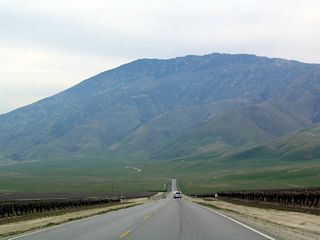 Even on this hazy day, Bear Mountain dominates the view of eastbound California 223 east of Arvin.