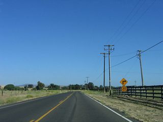The first of many sharp turns on southbound SR 229 is this 30 miles per hour curve preceding Iron Gate Road.