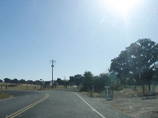 SR 229 (Webster Road) turns southwest at the intersection with Rocky Canyon Road. The trailblazer for SR 229 marking the turn was removed by 2012.