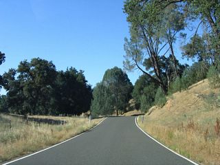 Continuing along northbound California 229, the next three miles are more of the same: narrow road, seemingly limitless live oaks and scrub, and undeveloped terrain.