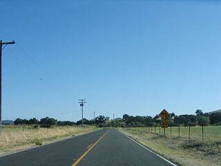 A sharp left turn lies along southbound California 229 after leaving the community of Creston.