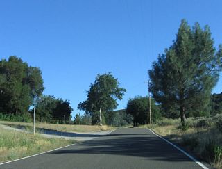 The final two miles of SR 229 south drop from 1,492 feet above sea level to 1,221 feet at SR 58 and Calf Canyon.