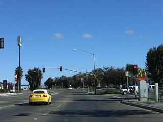 After passing through downtown and crossing the Union Pacific Railroad tracks, California 233 meets Chowchilla Boulevard, which offers connections to various freeway services.