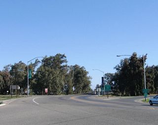 Northbound California 233 next meets California 99 (Golden State Freeway) south to Madera and Fresno and north to Merced, Modesto, Manteca, Stockton, and Sacramento. The first right turn connects to California 99 south; the second right turn links to California 99 north.