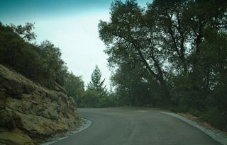 The one and a half lane portion of California 236 between the visitors center and a point north of the state park boundary. In the basin, tall redwood trees surround the roadway, but California 236 ascends out of the valley to provide some beautiful vistas of the countryside.