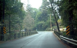 Northbound California 236 crosses over a creek near Lucille's Court. This is one of several older-style bridges located along the highway before it reaches the state park.