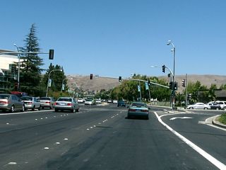 Eastbound California 237 (Calaveras Boulevard) approaches Milpitas Boulevard. This section of Calaveras Boulevard has a more residential feel, although businesses and commercial activities abound on both sides of the highway. The Milpitas library, civic center, and town center are all located on the north side of Calaveras Boulevard.