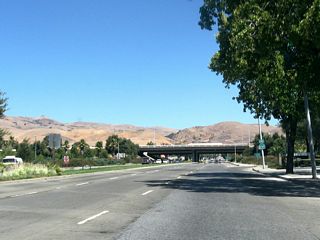 An end California 237 shield is posted after Hillview Drive and prior to the Interstate 680 interchange (Exits 11A-B). Calaveras Boulevard continues east through Milpitas, then enters Ed R. Levin County Park before turning north toward Calaveras Reservoir.