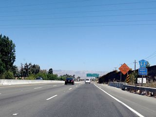 An auxiliary shield assembly for Santa Clara County G-2, which follows the Lawrence Expressway south from this interchange through Sunnyvale to Santa Clara, is posted on California 237 east prior to Exit 5.
