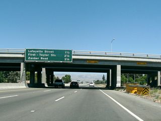 This original porcelain enamel interchange sequence sign provides the distance to the next three exits along California 237 east: Exit 6, Lafayette Street and Great America Parkway; Exit 7, North First Street; and Exit 8, Zanker Road.