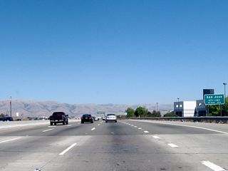 At this point, California 237 leaves the city of Sunnyvale and enters the city of San Jose, which is home to 894,943 people as of the 2000 Census. Founded on November 29, 1777, and incorporated on March 27, 1850, San Jose is the third largest city in California (behind Los Angeles and San Diego). San Jose consists of 178.2 square miles and sits at an elevation of 85 feet. Rainfall in San Jose is much less than San Francisco due to its location at the south end of the San Francisco Bay and enclosure within mountains. The average annual precipitation is 14.4 inches.
