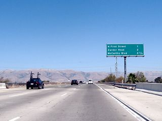 This interchange sequence sign provides the distance to the next three exits along California 237 east: Exit 7, North First Street; Exit 8, Zanker Road; and Exit 9A, McCarthy Boulevard and Cypress Street.