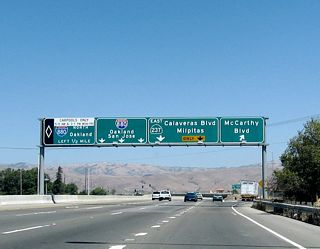 Eastbound California 237 (South Bay Freeway) reaches Exit 9A, McCarthy Boulevard and Cypress Street. The next two exits (Exit 9B, Interstate 880 (Nimitz Freeway) north to Oakland and Exit 9C, Interstate 880 (Nimitz Freeway) south to San Jose) are left exits, while the right two lanes continue east on California 237 (Calaveras Boulevard).