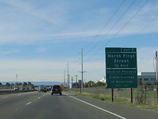 An auxiliary Exit 7 sign is posted on westbound California 237. Use North First Street south to the Guadalupe Light Rail Corridor, operated by the Santa Clara Valley Transportation Authority (VTA), the government organization that operates the mass transit service in Santa Clara County (buses and light rail), administers the transportation sales tax money in Santa Clara County, is the lead agency for implementing both the transportation improvements funded by the sales tax money and other highway improvements throughout the county, and performs the remaining functions of a typical regional transportation agency or council of governments, such as managing the Congestion Management Program and issuing guidelines for how traffic studies in the county should be performed.