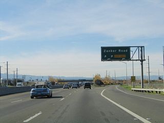 Westbound California 237 (South Bay Freeway) reaches Exit 8, Zanker Road.