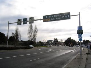 After the A Street intersection, southbound California 238 (Foothill Boulevard) approaches California 92/Jackson Street west and California 185 (Mission Boulevard) north. The left two lanes of California 238 will turn left onto Mission Boulevard south for the continuation of the state route, while the two right lanes will transition directly onto California 92 west to the San Mateo-Hayward Bridge.