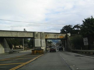 After the Stevenson Boulevard intersection near Fremont Central Park, southbound California 238 (Mission Boulevard) passes under the Union Pacific Railroad on this 1921 viaduct. Note that this stretch of California 238 is original concrete.