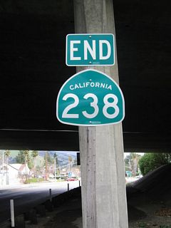 An end California 238 shield is posted in the shadow of the Interstate 680 overpass.