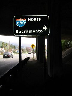 The second right turn connects to Interstate 680 north to Pleasanton, Walnut Creek, Concord, Fairfield, and Sacramento. Continue straight ahead to follow Mission Boulevard into Mission San Jose.
