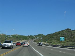 Shortly thereafter, eastbound Oso Parkway meets the on-ramp to California 241 (Foothill Transportation Corridor) north to Riverside. The assigned northbound control city is Riverside, as California 241 flows into California 91 in the Santa Ana Canyon. California 91 continues northeast from there toward Riverside.