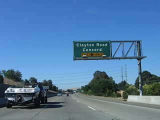 The first exit on northbound California 242 is Exit 1, Clayton Road east to downtown Concord. There is no access to Clayton Road from southbound California 242; this is a directional interchange that connects with Market Street to the east. Note that a fourth lane forms on the left side of the freeway at this point, thus ensuring that California 242 continues north with three through lanes.