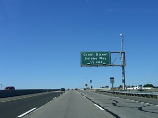 The next exit on California 242 is Exit 2, Solano Way/Grant Street. At this diamond interchange, Grant Street travels southeast to Mount Diablo Medical Center and downtown Concord, while Solano Way travels northwest toward an interchange with California 4 (California Delta Highway) and the oil refineries located north of California 4.