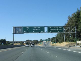 Northbound California 242 ends as the freeway splits. The left three lanes connect to Exit 3C, California 4 east to Pittsburg, Antioch, and Stockton, while the right lane becomes exit only for Exit 3B, California 4 west to Martinez and Hercules. Exit 3B also connects to Port Chicago Highway and also functions as a collector distributor lane for California 4 east.