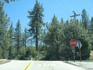 After the wye intersection, southbound California 243 meets California 74 at this stop sign. Turn left here for California 74 east to Palm Desert, Indio, and Coachella.