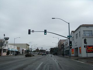 At I Street, California 246 (Ocean Avenue) enters downtown Lompoc.