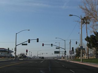 Barstow Road is a city-maintained street leading south from Downtown Barstow to Interstate 15. Virginia Way intersects the five lane boulevard ahead of the parclo interchange (Exit 183) with I-15.