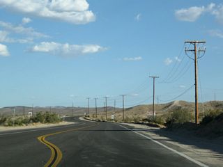 California 247 narrows to two lanes after the Veterans Parkway intersection.