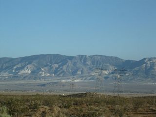 Against the backdrop of the San Bernardino Mountains, another set of Path 46 (West of Colorado River) power lines pass over California 246. These lines, which connect power generating stations along the Colorado River and points east, connect to the Southern California Edison electric grid at the Lugo substation in Hesperia. Two lines are 500kV, while the third line is 220kV.