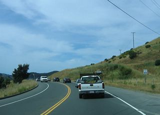 Two-lane Sir Francis Drake Boulevard carries a fair amount of traffic as it travels southwest toward San Quentin.