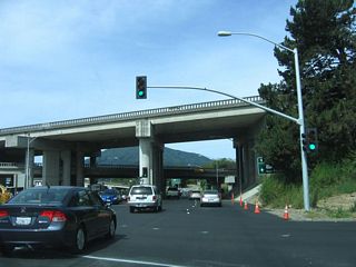 The interchange between Sir Francis Drake Boulevard and U.S. 101 (Redwood Highway) is a stack interchange, with a design that perhaps portended a future connection to a freeway California 251. However, that freeway proposal is all but dead. The connection to U.S. 101 south is the next left.