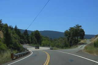 Crossing Anderson Creek at post mile 0.57, SR 253 west reaches the census designated place of Boonville.