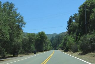 Traveling south from Robinson Creek, SR 253 gains around 400 feet in elevation before turning westward again through a series of S-curves and sharp turns.