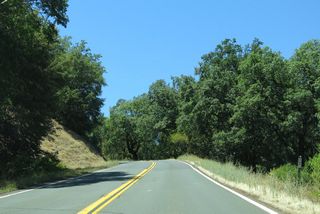 SR 253 westbound ascends to over 1,600 feet above sea level by post mile 11.84.