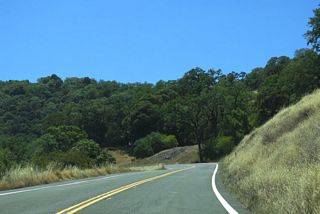 Navigation through an array of S-curves, SR 253 (Booneville Ukiah Road) climbs to over 2,000 feet above sea level by post mile 10.00.