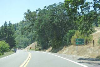 This mileage sign along California 253 west provides the distance to California 128 (16 miles), Boonville (16 miles), and California 1 (Shoreline Highway) (46 miles via California 128 west).