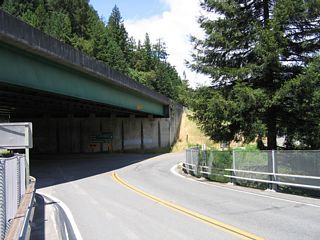 At the north end of the bridge over the South Fork of the Eel River, California 254 brushes under the U.S. 101 (Redwood Highway) freeway overpass, then turns northeast as a frontage road.