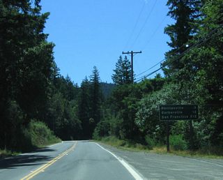 This mileage sign along southbound California 254 (Avenue of the Giants) provides the distance to Phillipsville (3 miles), Garberville (12 miles), and San Francisco (212 miles).