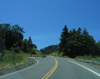 After passing under U.S. 101, all traffic on southbound California 254 (Avenue of the Giants) will merge onto U.S. 101 south. Turn right to follow Hooker Creek Road south along the South Fork Eel River.